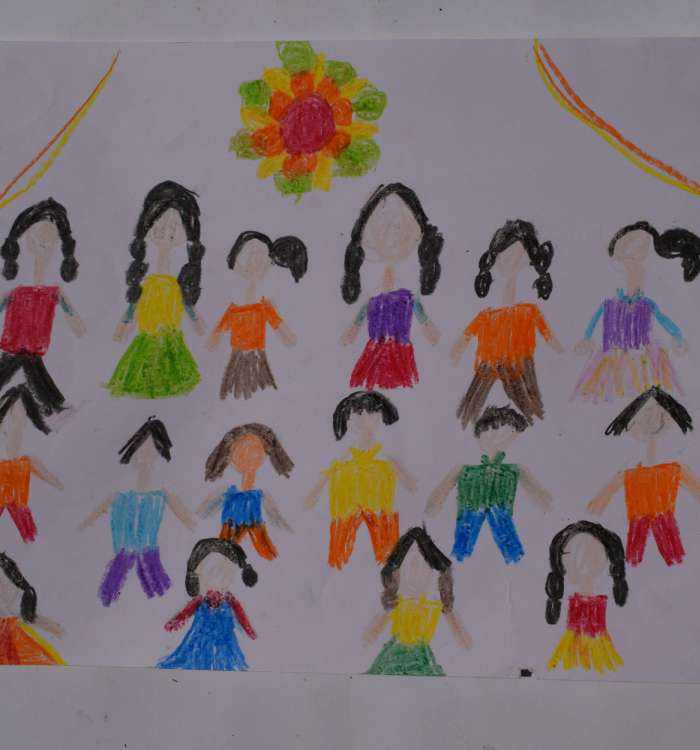 Closeup of a pastel drawing by a child, portraying several children dressed in vibrant hues standing in rows below a mandala.