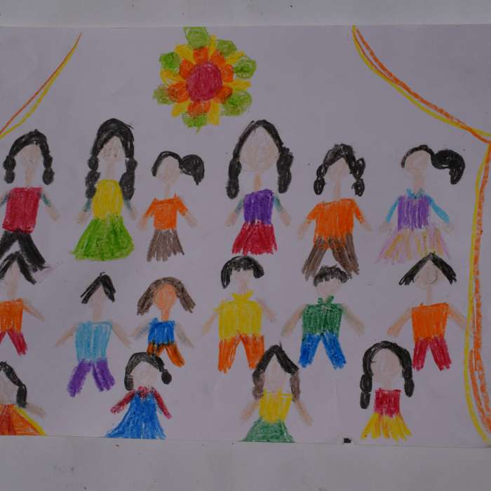 A pastel drawing by a child portraying a group of children dressed in vibrant colours standing in rows, a mandala above them.